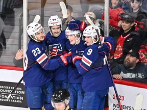 Chaz Lucius (16) of Team United States celebrates his goal with teammates Jack Peart (23), Sam Lipkin (22) and Jackson Blake (9) during the second period against Team Sweden in the bronze medal round of the 2023 IIHF World Junior Championship at Scotiabank Centre on Jan. 5, 2023 in Halifax, N.S.
