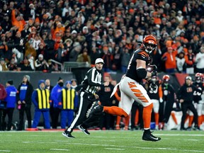 Cincinnati Bengals defensive end Sam Hubbard (94) recovers and returns a fumble for a touchdown  in the fourth quarter during an NFL wild-card playoff football game between the Baltimore Ravens and the Cincinnati Bengals Jan 15, 2023 at Paycor Stadium.