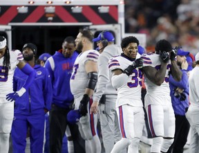 Buffalo Bills cornerback Cam Lewis (39) and cornerback Siran Neal (33) react to the injury of safety Damar Hamlin (not pictured) during the first quarter against the Cincinnati Bengals at Paycor Stadium Jan 2, 2023. Joseph Maiorana-USA TODAY Sports