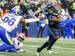 Jan 8, 2023; Seattle, Washington, USA; Seattle Seahawks running back Kenneth Walker III (9) rushes against the Los Angeles Rams during the fourth quarter at Lumen Field.