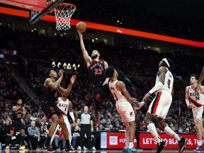 Toronto Raptors shooting guard Fred VanVleet goes in for a basket against Portland Trail Blazers shooting guard Anfernee Simons at Moda Center Saturday night. USA TODAY SPORTS