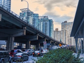 Car traffic jam at the entrance of the Gardiner Expressway in downtown Toronto.