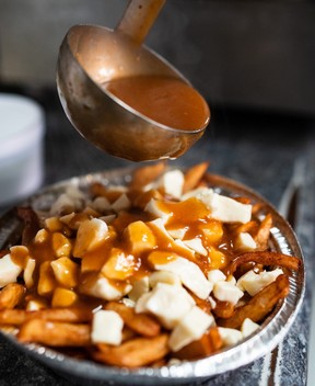 Poutine, a Quebecois dish of french fries, cheese curds and bbq gravy sauce, – johany/Getty Images
