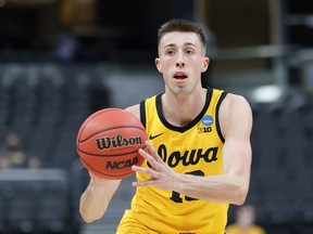 Joe Wieskamp of the Iowa Hawkeyes handles the ball in the game against the Oregon Ducks in the second round of the 2021 NCAA Men's Basketball Tournament at Bankers Life Fieldhouse on March 22, 2021 in Indianapolis, Indiana.