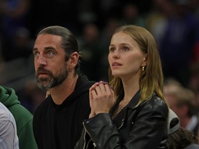 Aaron Rodgers and Mallory Edens watch Game 2 of the Eastern Conference First Round Playoffs between the Milwaukee Bucks and the Chicago Bulls at Fiserv Forum on April 20, 2022 in Milwaukee, Wisconsin.
