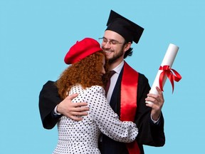 Woman Hugs Graduate Boyfriend