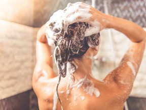 A woman taking a shower, likely coming up with great ideas.