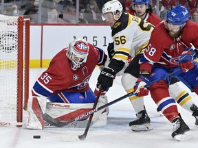 Montreal Canadiens goalie Sam Montembeault stops Boston Bruins forward Erik Haula during the third period at the Bell Centre.