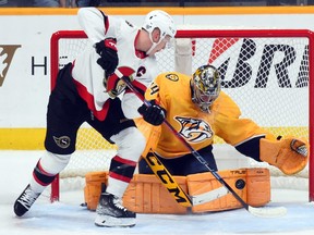 Predators goaltender Juuse Saros makes a save on a shot by Senators left wing Brady Tkachuk during the first period at Bridgestone Arena in Nashville, Dec 10, 2022.