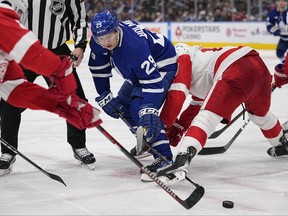 Toronto Maple Leafs forward Pontus Holmberg battles for a puck off of a face off against the Detroit Red Wings during the third period at Scotiabank Arena.