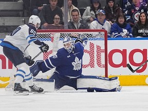 Maple Leafs goaltender Ilya Samsonov makes a save against Winnipeg Jets' Pierre-Luc Dubois during the third period at Scotiabank Arena on Thursday, Jan. 19, 2023.