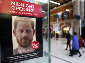 A poster advertising the launch of the book "Spare", by Britain's Prince Harry, the Duke of Sussex, is seen in the window of a bookstore in London, Britain, Monday, Jan. 9, 2023.
