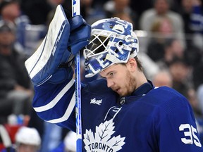Toronto Maple Leafs goalie Ilya Samsonov adjusts his mask before play resumes against the St. Louis Blues in the second period at Scotiabank Arena in Toronto, Jan. 3, 2023.