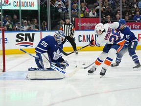 New York Islanders defenceman Alexander Romanov (28) attempts a shot on Maple Leafs goaltender Ilya Samsonov during Toronto's win at Scotiabank Arena on Monday night.