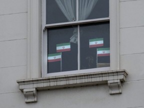 Iranian flags are displayed in the window of the Iranian embassy in London, England, Saturday, Jan. 14, 2023. Iran announced the execution by hanging of Ali Reza Akbari, a 61-year-old former Iranian defence official with dual British citizenship who was accused of espionage.
