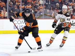 Ivan Provorov, left, of the Philadelphia Flyers skates with the puck past Max Jones of the Anaheim Ducks during the third period at Wells Fargo Center on Jan. 17, 2023 in Philadelphia, Pa.