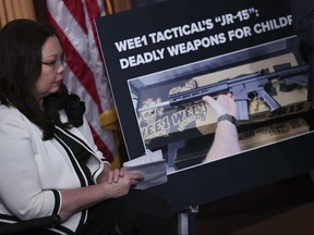 Sen. Tammy Duckworth (D-IL) joins with other Democratic members of the Senate at a U.S. Capitol press conference condemning WEE1 Tactical's "JR-15" rifle marketed to children Jan. 26, 2023 in Washington, D.C.