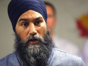 Federal NDP leader Jagmeet Singh speaks to media after talking to members of the The United Steelworkers union in Calgary on Friday, Dec. 2, 2022.
