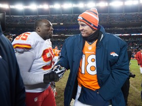 Quarterback Peyton Manning, right, of the Denver Broncos shakes hands with nose tackle Jerrell Powe of the Kansas City Chiefs after a game at Sports Authority Field Field at Mile High on Dec. 30, 2012 in Denver, Colorado.