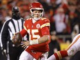 Patrick Mahomes #15 of the Kansas City Chiefs looks to pass against the Cincinnati Bengals during the third quarter in the AFC Championship Game at GEHA Field at Arrowhead Stadium on Sunday.