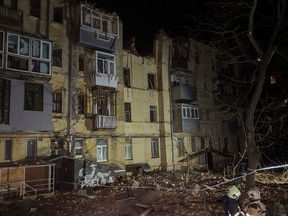A view of an apartment building severely damaged by a Russian missile, amid Russia's attack on Ukraine, in Kharkiv, Sunday, Jan. 30, 2023.