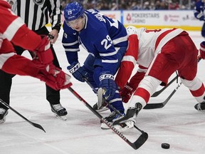 Leafs forward Pontus Holmberg battles for a puck off of a faceoff against the Detroit Red Wings Saturday night.  USA TODAY Sports