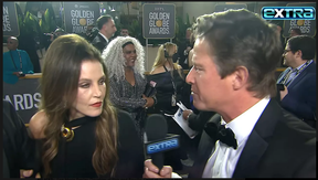 Lisa Marie Presley seen with Extra host Billy Bush at the Golden Globes earlier this month.