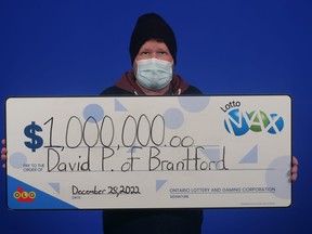 David Proceviat, of Brantford, with his Maxmillions prize worth $1 million from the Oct., 14, 2022 Lotto Max draw.