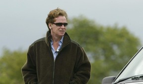 Major James Hewitt watches a semifinal match of The Veuve Clicquot Cup between Dubai and Hildon Sport at The Cowdray Park Polo Club July 17, 2003 Midhurst, England.