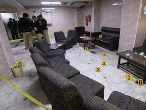 Police officers survey the crime scene after, according to police, a gunman killed Abdul Latif Afridi, lawyer and former president of Pakistan’s Supreme Court Bar Association, in Peshawar, Pakistan January 16, 2023.