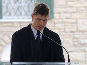 Ben Smith-Petersen, reads a speech on behalf of his wife, Riley Keough, during a public memorial for singer Lisa Marie Presley, the only daughter of the "King of Rock 'n' Roll," Elvis Presley, at Graceland Mansion in Memphis, Tenn., Jan. 22, 2023.