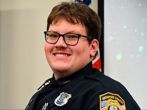 Memphis Police Department officer Preston Hemphill poses at a graduation ceremony for the 97th Crisis Intervention Class in Memphis, Tenn., July 21, 2022.