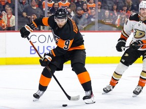 Ivan Provorov #9 of the Philadelphia Flyers skates with the puck past Max Jones #49 of the Anaheim Ducks during the third period at Wells Fargo Center on January 17, 2023 in Philadelphia, Pennsylvania.