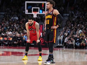 Toronto Raptors guard Fred VanVleet and Atlanta Hawks guard Trae Young wait for the play to start during the third quarter at the Scotiabank Arena.