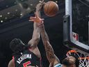 Jan 12, 2023; Toronto, Ontario, CAN; Charlotte Hornets center Nick Richards (4) defends against Toronto Raptors forward Precious Achiuwa (5) during the second half at Scotiabank Arena. Mandatory Credit: John E. Sokolowski-USA TODAY Sports
