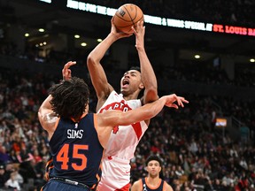 Raptors forward Scottie Barnes shoots over New York Knicks centre Jericho Sims at Scotiabank Arena on Sunday. Barnes is looking every bit — and more — like the player he was a year ago when he earned rookie of the year honours.