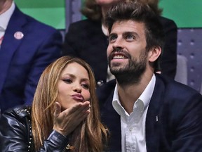 Colombian singer Shakira blows a kiss next to her former  husband Barcelona soccer player Gerard Pique while watching the Davis Cup final in Madrid, Spain, on Nov. 24, 2019.