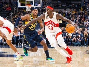 Raptors forward Pascal Siakam (right) dribbles against Indiana Pacers guard Buddy Hield on Monday night at Gainbridge Fieldhouse. It was another loss for Toronto.