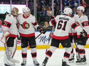 Members of the Ottawa Senators celebrate after their team's win against the Toronto Maple Leafs at Scotiabank Arena on Jan. 27, 2023.