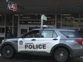 A Toronto Police cruiser and officers outside of Wellesley subway station on Jan. 26, 2023. That location is considered one of the "hotspots" in the city, according to a TTC  official.