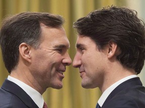 Prime Minister Justin Trudeau, right, goes face-to-face with Finance Minister Bill Morneau at Rideau Hall in Ottawa on Wednesday, November 4, 2015. The political messaging that will weave through Justin Trudeau's first budget is poised to have a recognizable ring to it: reducing inequality while laying the groundwork for long-term economic growth. THE CANADIAN PRESS/Sean Kilpatrick