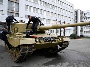 After U.S. offer, Germany unleashes Leopard tanks for Ukraine Members of the military walk on a tank, as Germany delivers its first Leopard tanks to Slovakia as part of a deal after Slovakia donated fighting vehicles to Ukraine, in Bratislava, Slovakia, December 19, 2022.