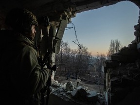 A Ukrainian serviceman looks on, amid Russia's attack on Ukraine, in Bakhmut, Donetsk region, Ukraine, Jan. 27, 2023.