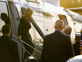 First lady Jill Biden disembarks Marine One with U.S. President Joe Biden at Walter Reed Medical Center, where Mrs. Biden is scheduled to undergo Mohs surgery to remove a "small lesion" above her right eye, in Bethesda, Maryland, January 11, 2023.