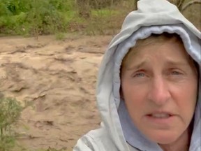 Actress-comedian Ellen DeGeneres is seen in a video of herself standing besides muddy rapids flowing through what she described as a normally dry creek bed near her property, in Santa Barbara, California, in this screen grab obtained from a social media video released January 9, 2023.
