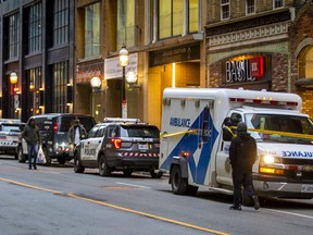Toronto Police attend the scene after an elderly woman was killed in a suspected unprovoked assault at Yonge and King Sts. in Toronto on Friday. Jan. 20, 2023.