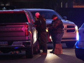 Las Vegas police work near the home of former actor Nathan Lee Chasing His Horse, who goes by Nathan Chasing Horse, Tuesday, Jan. 31, 2023, in North Las Vegas, Nev.