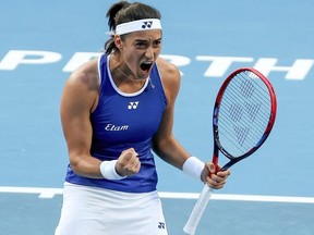France's Caroline Garcia celebrates her victory against Croatia's Petra Martic during their womens singles match at the United Cup tennis tournament in Perth on January 3, 2023.