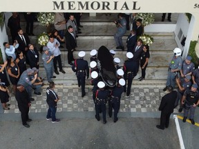 The coffin of the late Brazilian football star Pele arrives to the Santos' Memorial Cemetery after the funeral procession in Santos, Sao Paulo state, Brazil on January 3, 2023.