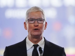 Apple CEO Tim Cook speaks in front of the new Taiwan Semiconductor Manufacturing Company facility under construction in Phoenix, Dec. 6, 2022.